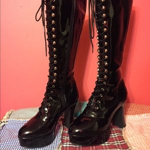 Knee high black boots by Spirit